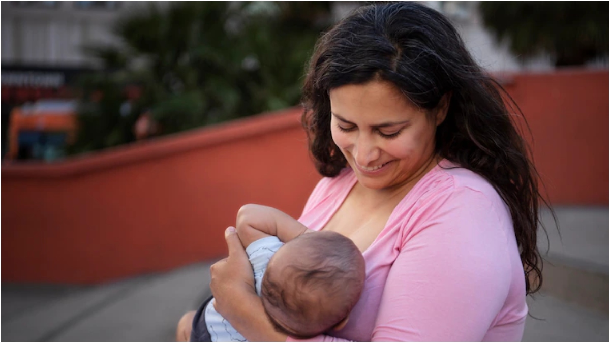 Mother breastfeeding during breastfeeding week, highlighting the importance of breastfeeding, in the Aura Breastfeeding Workshop.